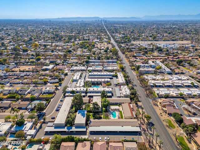 birds eye view of property featuring a mountain view