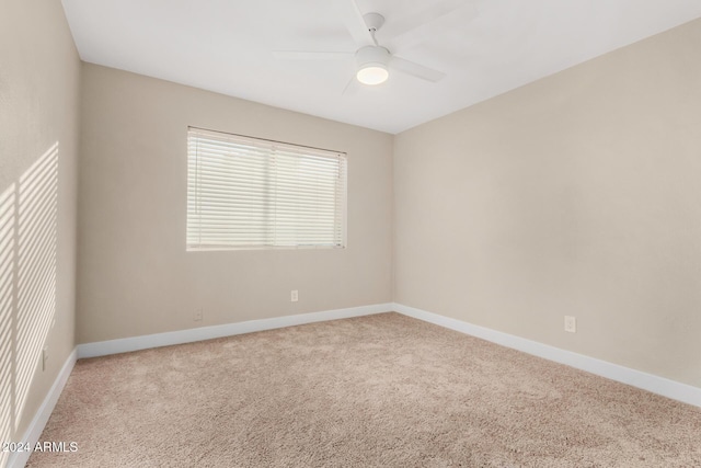 carpeted empty room with ceiling fan