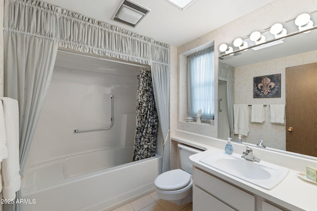 full bathroom featuring tile patterned flooring, vanity, shower / bath combo, and toilet