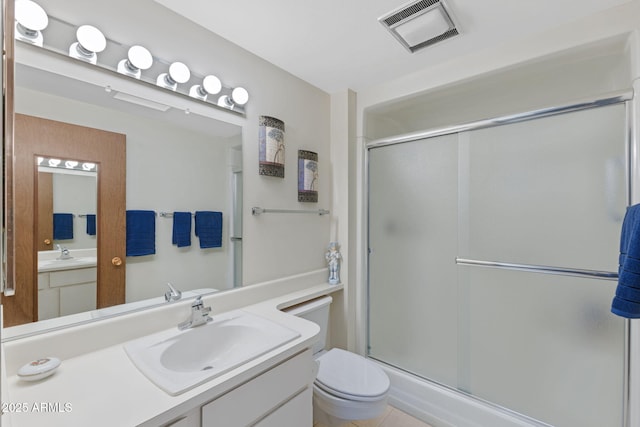 bathroom with vanity, toilet, and an enclosed shower