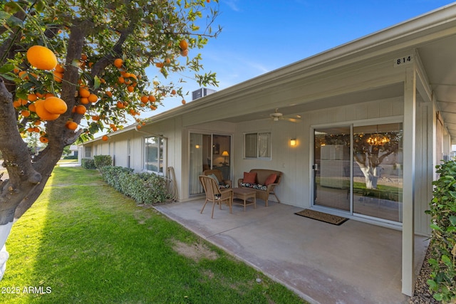 view of yard featuring an outdoor hangout area, a patio, and ceiling fan