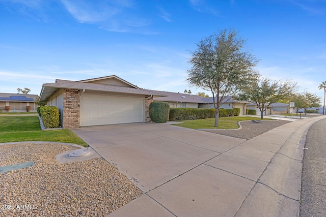 ranch-style home featuring a garage and a front yard