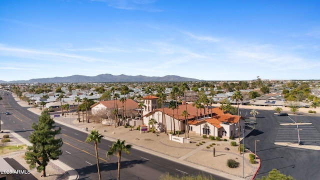 birds eye view of property featuring a mountain view