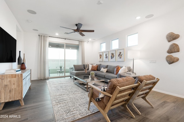 living room featuring dark hardwood / wood-style flooring and ceiling fan