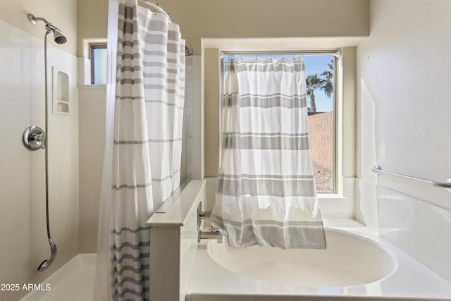 full bathroom with a healthy amount of sunlight and a shower with curtain