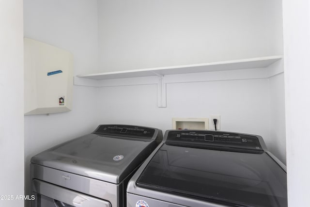 laundry room with washing machine and dryer