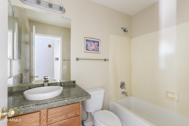 bathroom with shower / tub combination, vanity, and toilet