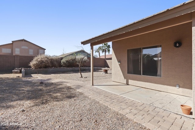 view of yard featuring a patio area and a fenced backyard