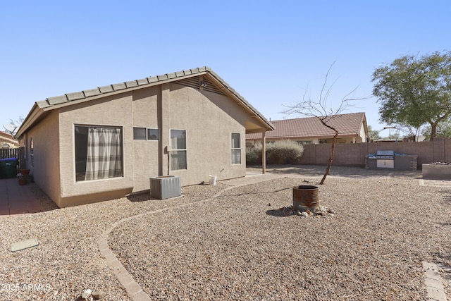 back of house featuring a patio area, fence, and stucco siding