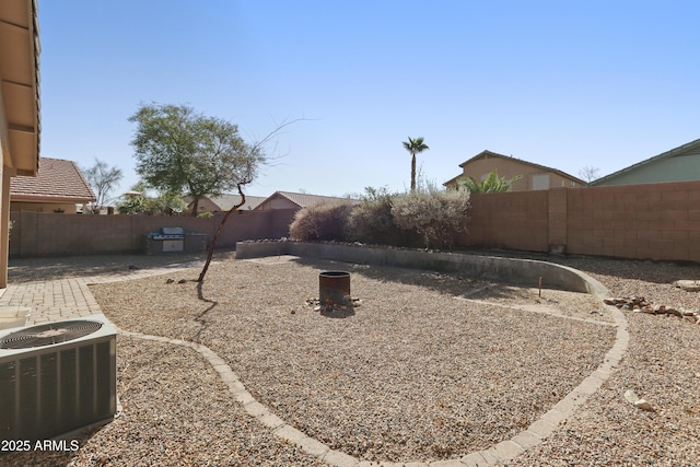 view of yard featuring a patio, a fenced backyard, and cooling unit