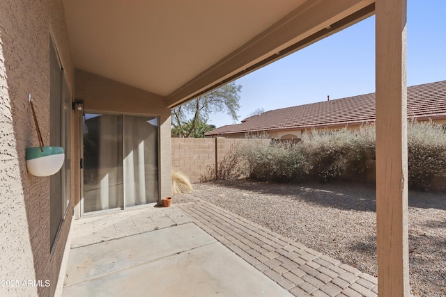 view of patio / terrace featuring fence