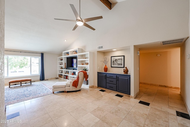 living area featuring high vaulted ceiling, visible vents, ceiling fan, and baseboards