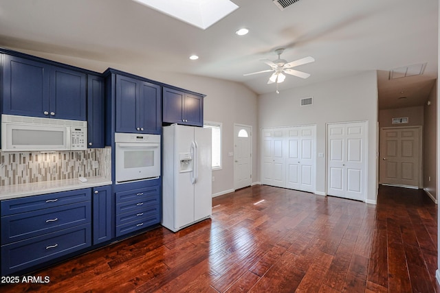 kitchen with blue cabinets, white appliances, visible vents, light countertops, and dark wood-style floors