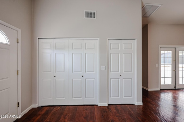 entrance foyer featuring french doors, visible vents, baseboards, and dark wood-style flooring