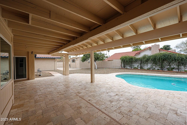 view of pool with a fenced in pool, a patio area, and fence