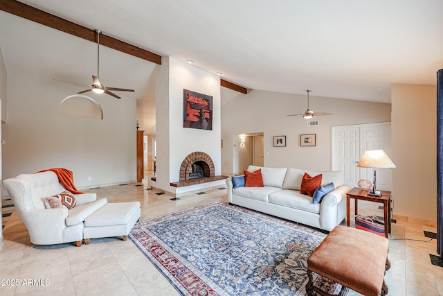 living area featuring visible vents, ceiling fan, a brick fireplace, beam ceiling, and light tile patterned flooring