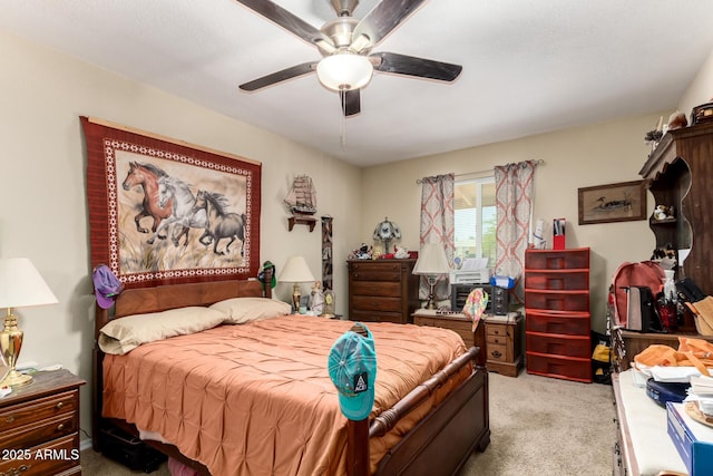 bedroom featuring light colored carpet and a ceiling fan