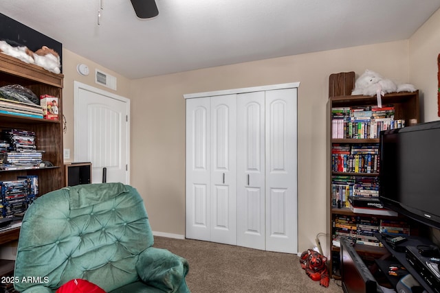 office space with carpet floors, ceiling fan, and visible vents
