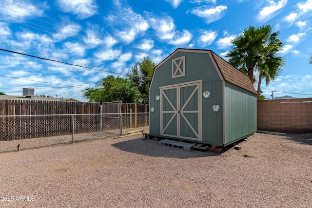 view of shed featuring a fenced backyard
