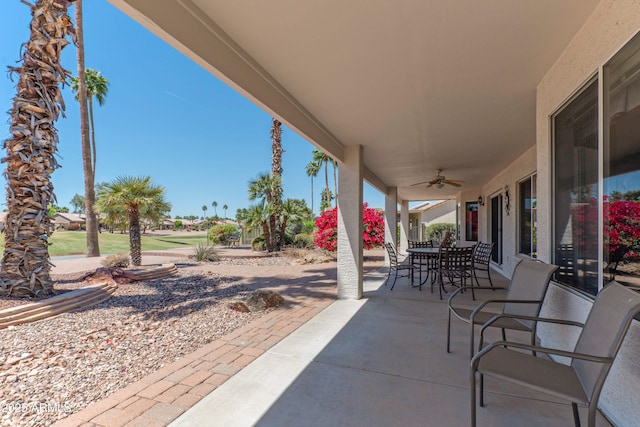 15371 W Piccadilly Rd, Goodyear, AZ 85395 - view of patio / terrace featuring outdoor dining space and ceiling fan