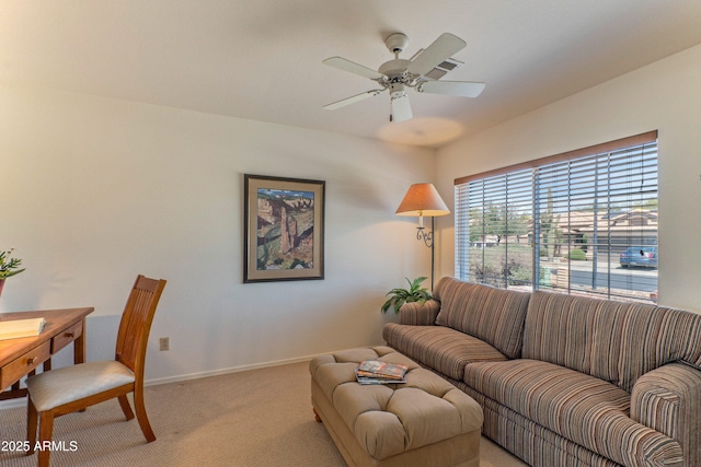 15371 W Piccadilly Rd, Goodyear, AZ 85395 - living area with ceiling fan, light carpet, and baseboards