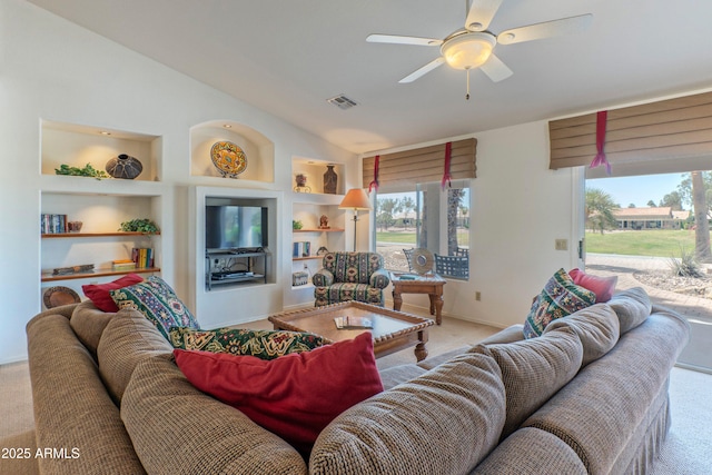 15371 W Piccadilly Rd, Goodyear, AZ 85395 - carpeted living area with visible vents, baseboards, built in features, ceiling fan, and vaulted ceiling