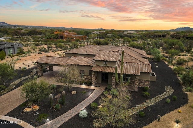 8597 E Arroyo Seco Rd, Scottsdale, AZ 85266 - aerial view at dusk featuring a mountain view