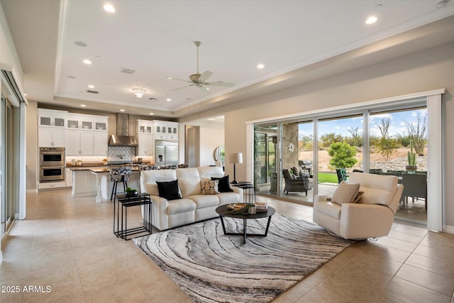 8597 E Arroyo Seco Rd, Scottsdale, AZ 85266 - living area featuring recessed lighting, a ceiling fan, a tray ceiling, and light tile patterned floors