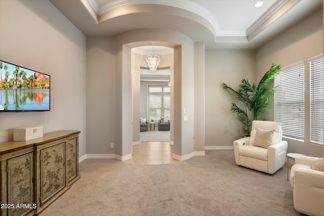 8597 E Arroyo Seco Rd, Scottsdale, AZ 85266 - sitting room with light carpet, arched walkways, baseboards, crown molding, and a raised ceiling