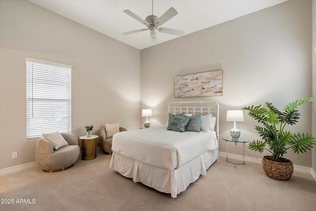 8597 E Arroyo Seco Rd, Scottsdale, AZ 85266 - carpeted bedroom with lofted ceiling, baseboards, and ceiling fan