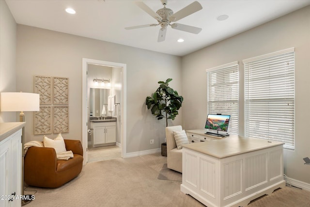 8597 E Arroyo Seco Rd, Scottsdale, AZ 85266 - office with light carpet, baseboards, ceiling fan, and a sink