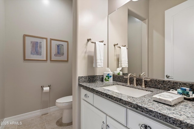 8597 E Arroyo Seco Rd, Scottsdale, AZ 85266 - bathroom with vanity, toilet, baseboards, and tile patterned floors