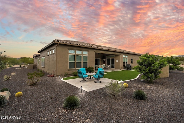 8597 E Arroyo Seco Rd, Scottsdale, AZ 85266 - back of property featuring a tiled roof, a patio, and stucco siding