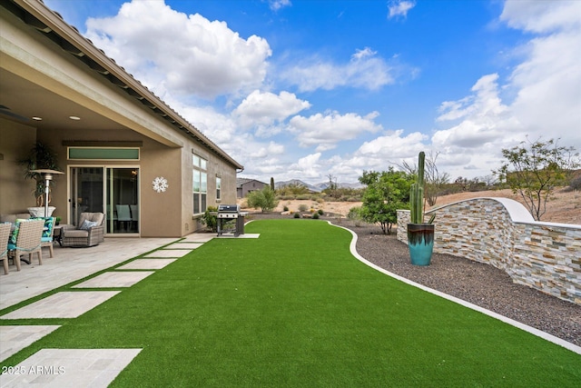 8597 E Arroyo Seco Rd, Scottsdale, AZ 85266 - view of yard featuring a patio area and an outdoor living space