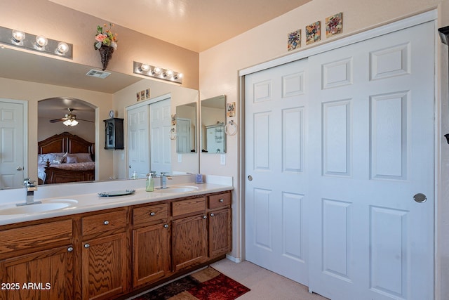 bathroom with vanity and ceiling fan