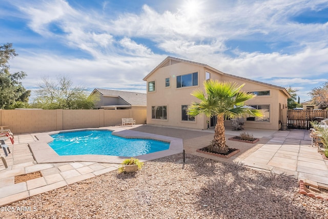 view of swimming pool with a patio area