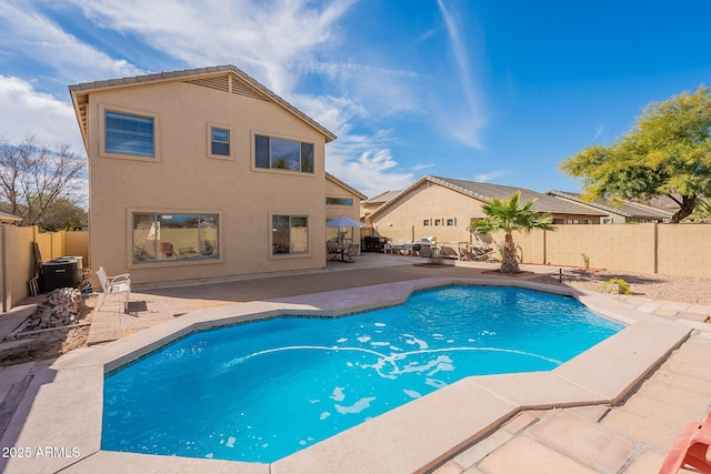 view of pool featuring a patio and central air condition unit