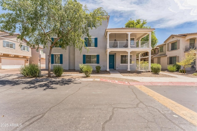 1717 E Joseph Way, Gilbert, AZ 85295 - view of front of home featuring a balcony, covered porch, and stucco siding