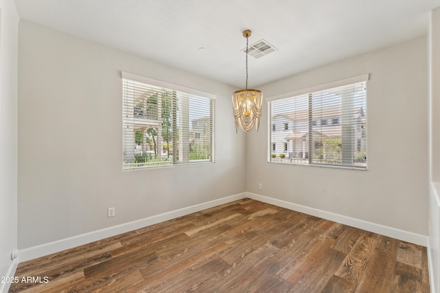 1717 E Joseph Way, Gilbert, AZ 85295 - empty room with a chandelier and wood finished floors