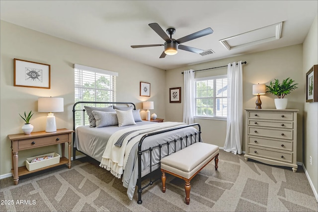 1717 E Joseph Way, Gilbert, AZ 85295 - bedroom with multiple windows, attic access, ceiling fan, and light carpet