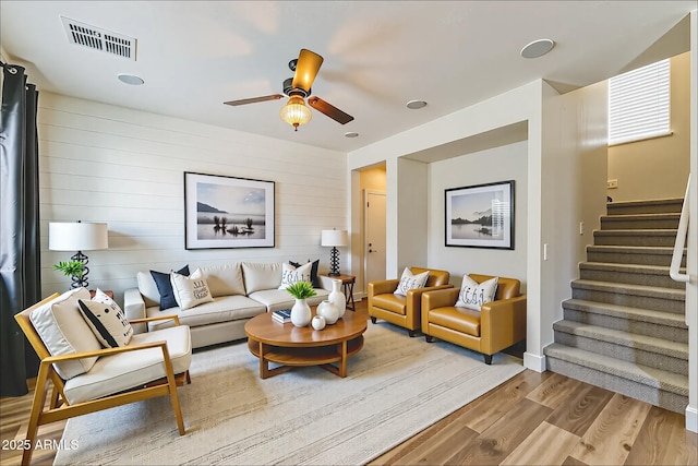 1717 E Joseph Way, Gilbert, AZ 85295 - living room with wood finished floors, stairway, ceiling fan, and wood walls