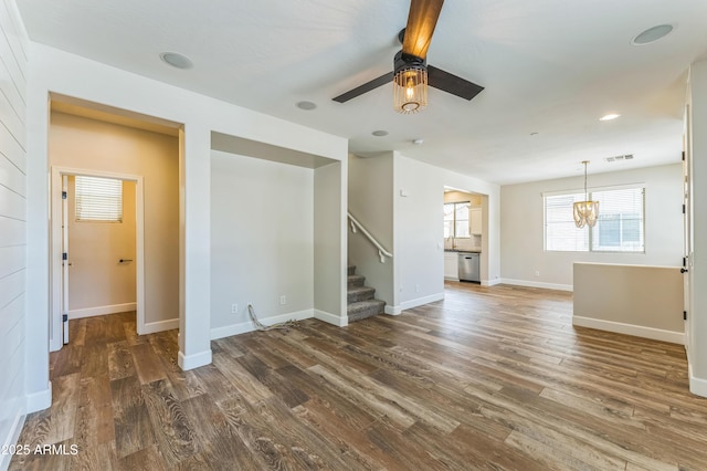 1717 E Joseph Way, Gilbert, AZ 85295 - unfurnished living room with a ceiling fan, wood finished floors, stairway, and a chandelier