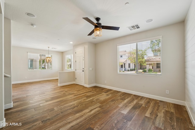 1717 E Joseph Way, Gilbert, AZ 85295 - spare room with wood finished floors, a ceiling fan, a smoke detector, a chandelier, and recessed lighting