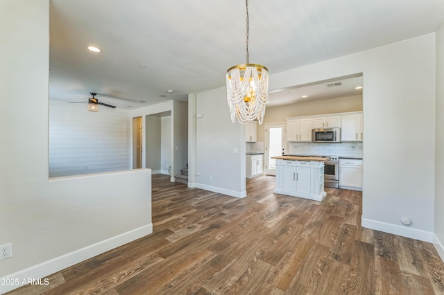 1717 E Joseph Way, Gilbert, AZ 85295 - kitchen with appliances with stainless steel finishes, open floor plan, a chandelier, wooden counters, and white cabinets