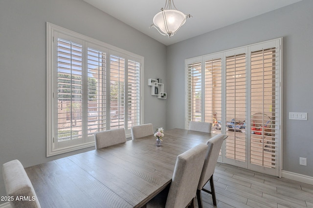 9345 W Robin Ln, Peoria, AZ 85383 - dining room featuring plenty of natural light, light wood-style floors, and baseboards
