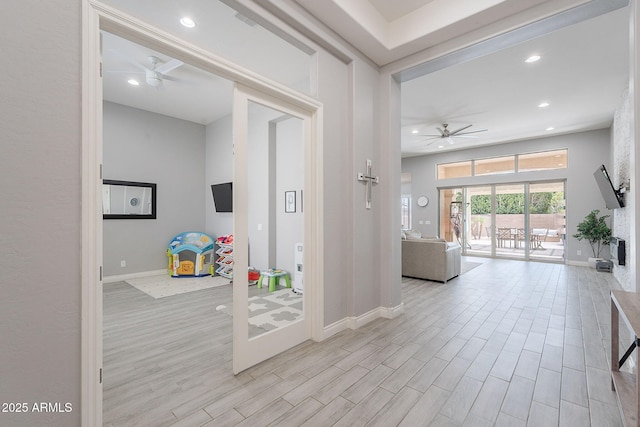 9345 W Robin Ln, Peoria, AZ 85383 - hallway with baseboards, wood finished floors, and recessed lighting