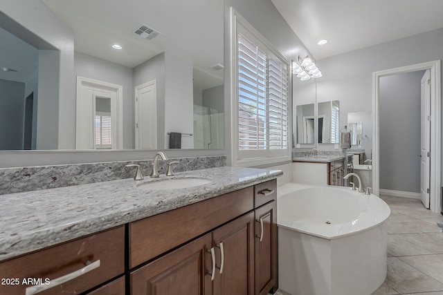 9345 W Robin Ln, Peoria, AZ 85383 - full bathroom with a tub to relax in, plenty of natural light, tile patterned flooring, and a stall shower
