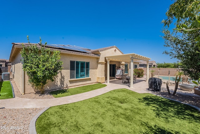 9345 W Robin Ln, Peoria, AZ 85383 - back of house featuring a pergola, solar panels, central air condition unit, stucco siding, and a patio area