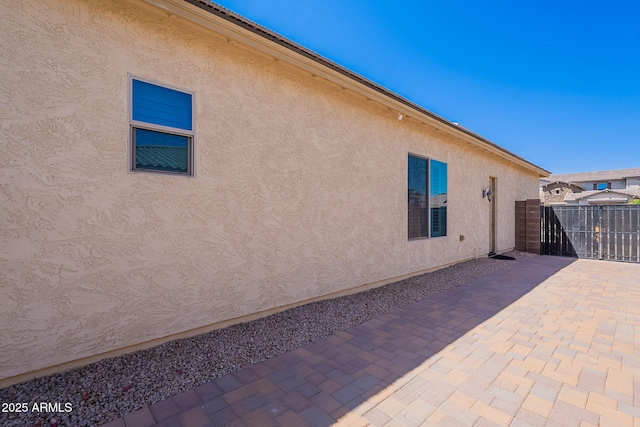 9345 W Robin Ln, Peoria, AZ 85383 - view of side of home with a patio and stucco siding