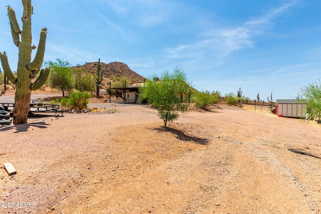 5484 E 36th Ave, Apache Junction, AZ 85119 - view of yard featuring a mountain view and an outdoor structure
